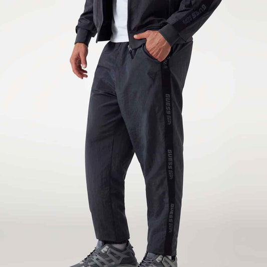 Trenerka të poshtme GUESS GUERINO CUFFED PANT