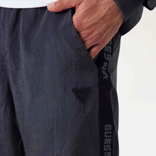 Trenerka të poshtme GUESS GUERINO CUFFED PANT